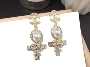New joker cross pearl earrings